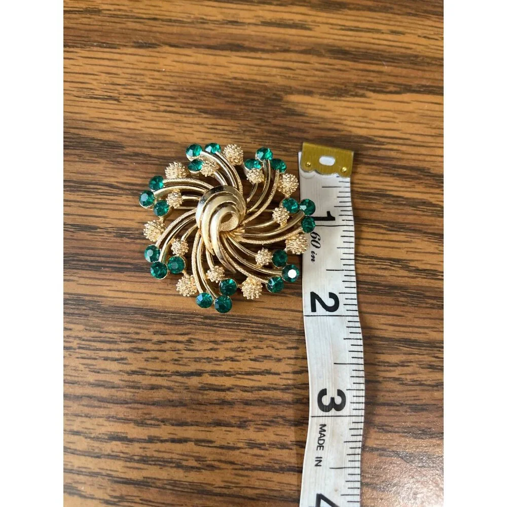 Crown Trifari gold tone and green emerald rhinestone brooch vintage